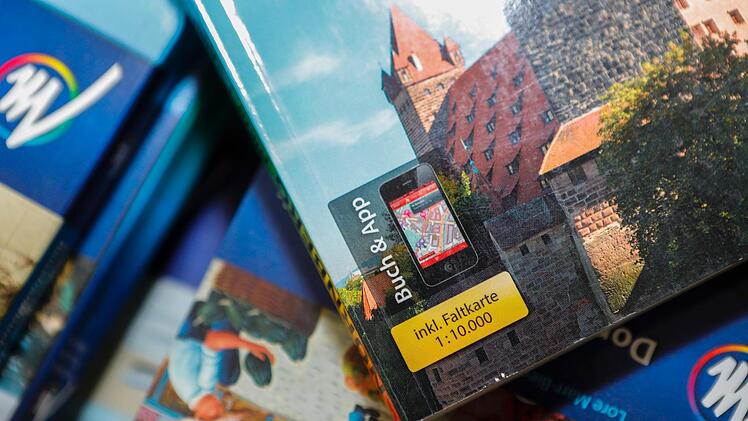 In den Anfangszeiten der digitalen Reiseführer  gab es in den Büchern Gutscheincodes für die Apps. Jetzt kann man sie  als eigenständige Angebote kaufen. Foto: Matthias Hoch