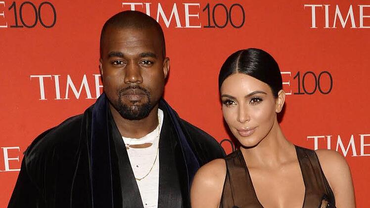 Kim Kardashian und Kanye West freuen sich über drittes Kind. Archivbild: dpa/epa/Justin Lane